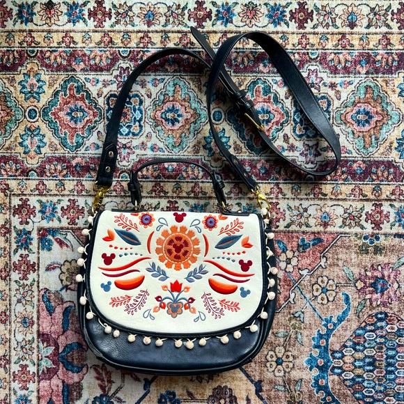 Disney Handbags - Disney Boutique faux leather bohemian pompom crossbody purse